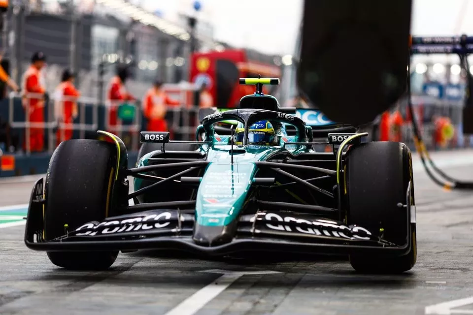 Fernando Alonso, Aston Martin AMR24, in the pit lane