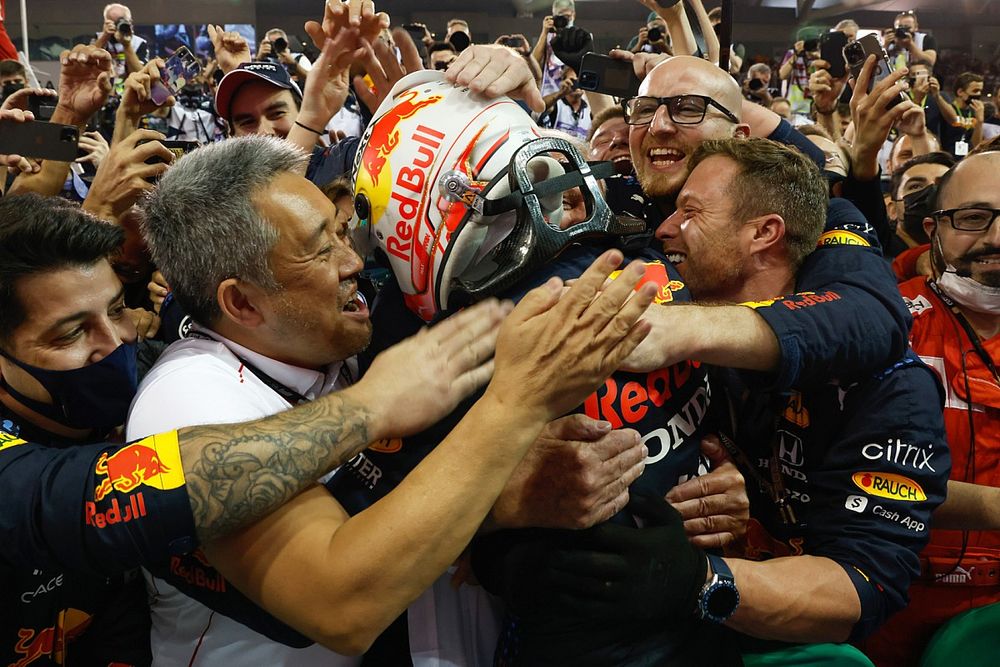 2021 drivers champion Max Verstappen, Red Bull Racing, 1st position, celebrates in Parc Ferme with his team, including Masashi Yamamoto, General Manager, Honda Motorsport