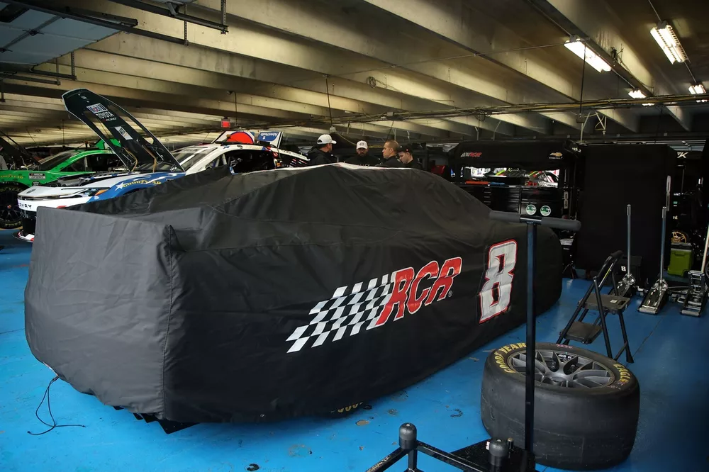 Kyle Busch's car cover over the No. 33 Richard Childress Racing entry of Austin Hill
