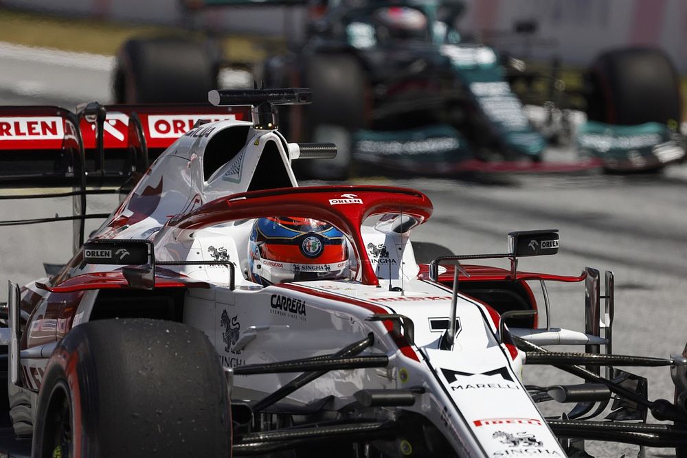 Kimi Raikkonen, Alfa Romeo Racing C41, and Sebastian Vettel, Aston Martin AMR21, practice their race start procedures at the end of FP3