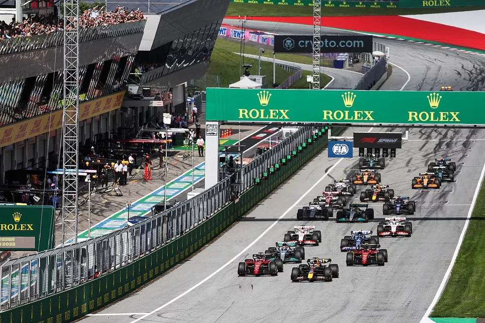 Max Verstappen, Red Bull Racing RB18, Charles Leclerc, Ferrari F1-75, lead the field away for the start