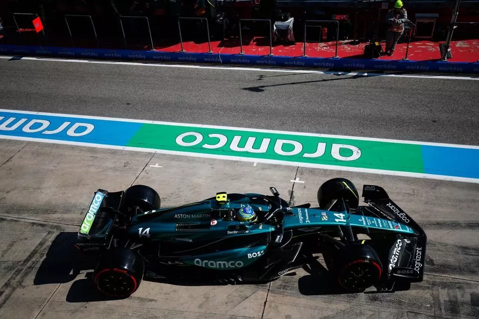 Fernando Alonso, Aston Martin AMR24, leaves the garage