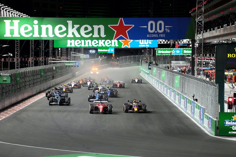 Charles Leclerc, Ferrari SF-23, battles with Max Verstappen, Red Bull Racing RB19, ahead of George Russell, Mercedes F1 W14, Pierre Gasly, Alpine A523, Alex Albon, Williams FW45, Logan Sargeant, Williams FW45, the rest of the field at the start