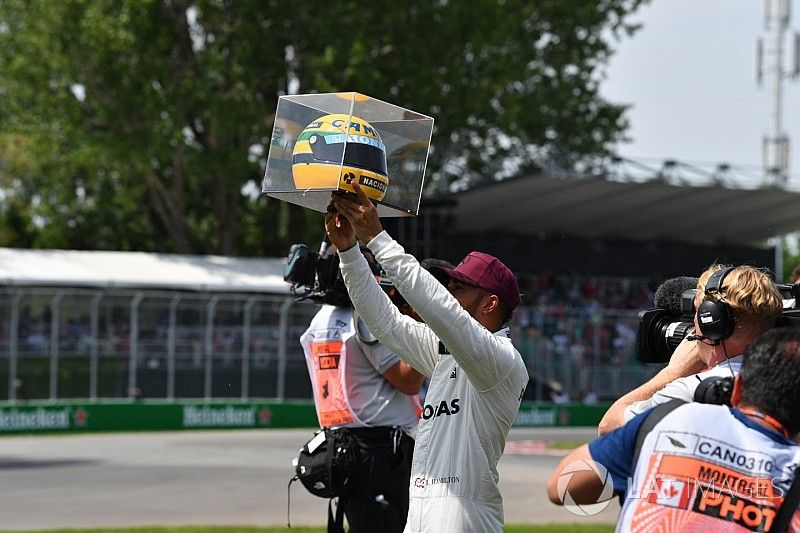 Pole sitter Lewis Hamilton, Mercedes AMG F1 celebrates with the helmet of Ayrton Senna