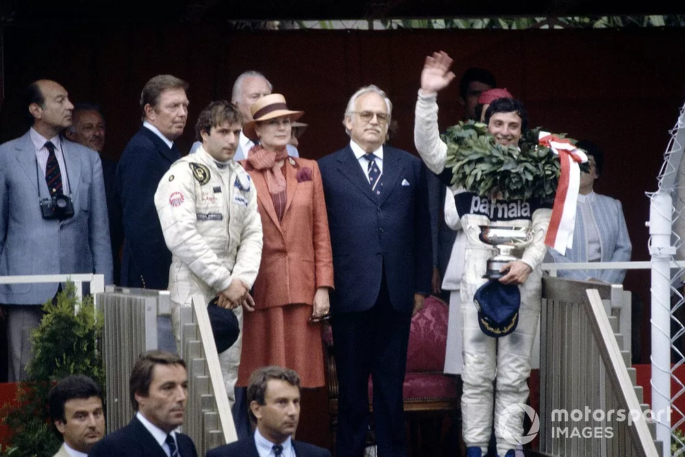 Podium: Race winner Riccardo Patrese, Brabham BT49D-Ford Cosworth, third place (later fifth place) Elio de Angelis, Lotus 91-Ford Cosworth, Princess Grace and Prince Rainier