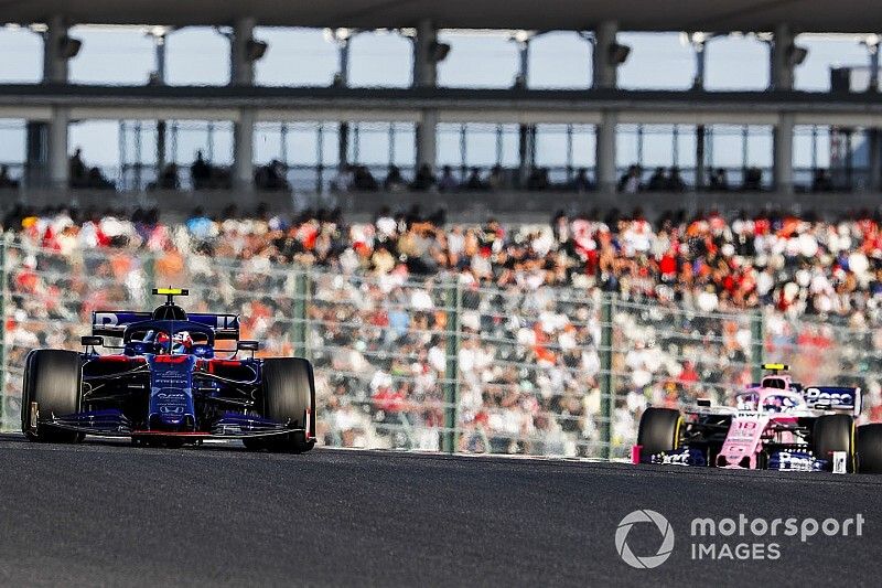 Pierre Gasly, Toro Rosso STR14, leads Lance Stroll, Racing Point RP19