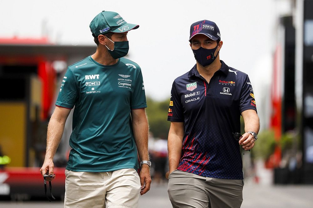 Sebastian Vettel, Aston Martin and Sergio Perez, Red Bull Racing in the paddock