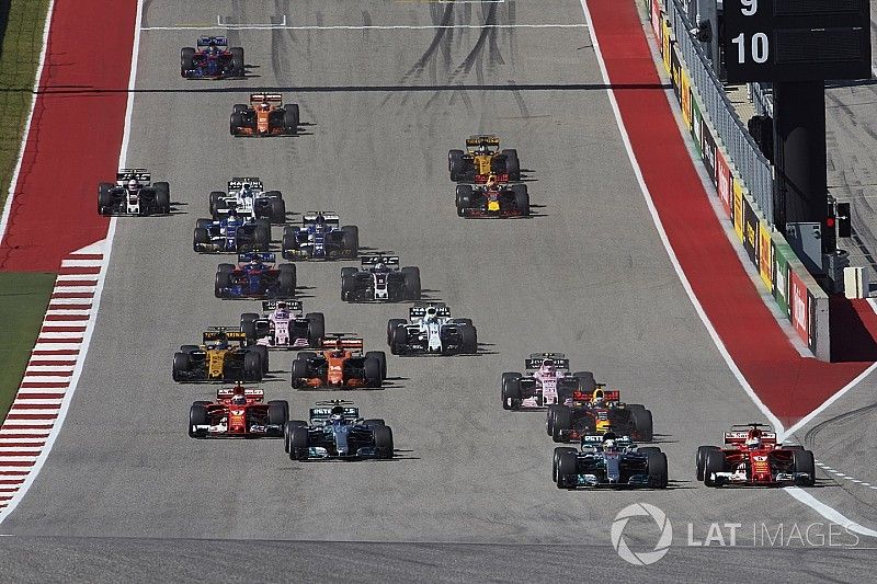 Lewis Hamilton, Mercedes AMG F1 W08, battles with Sebastian Vettel, Ferrari SF70H, ahead of the rest