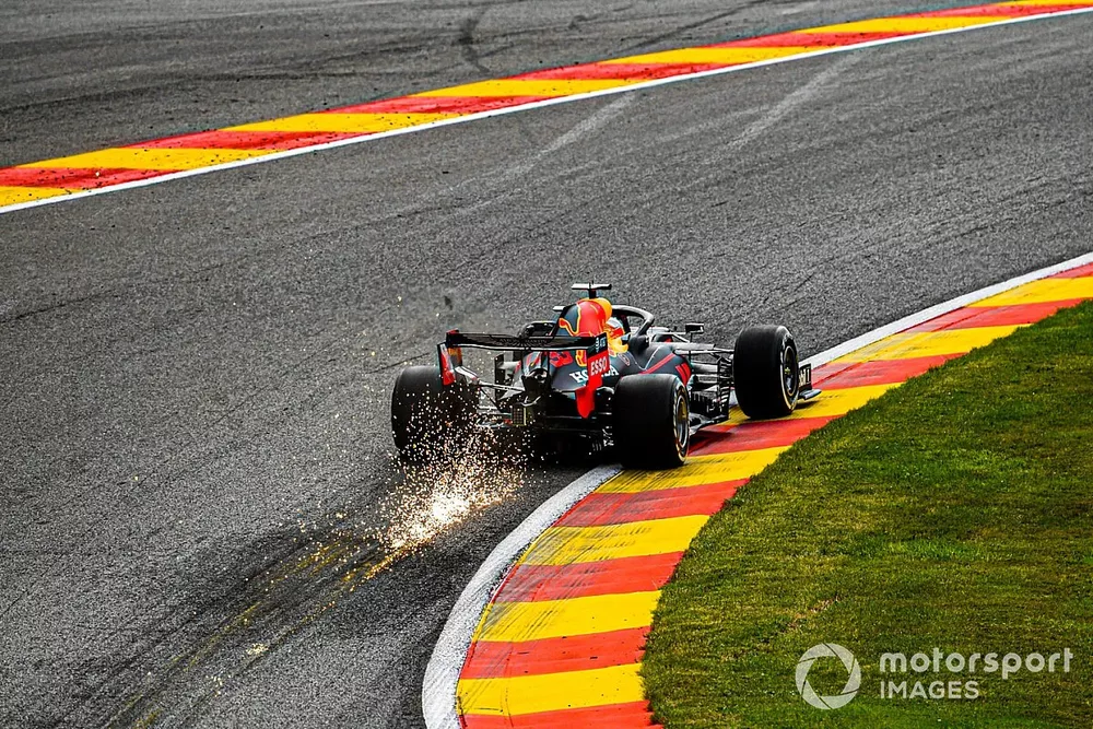 Sparks fly from the rear of Max Verstappen, Red Bull Racing RB16