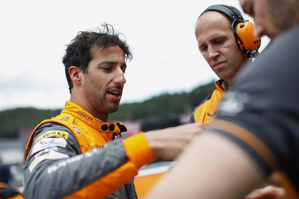Daniel Ricciardo, McLaren, with his engineers