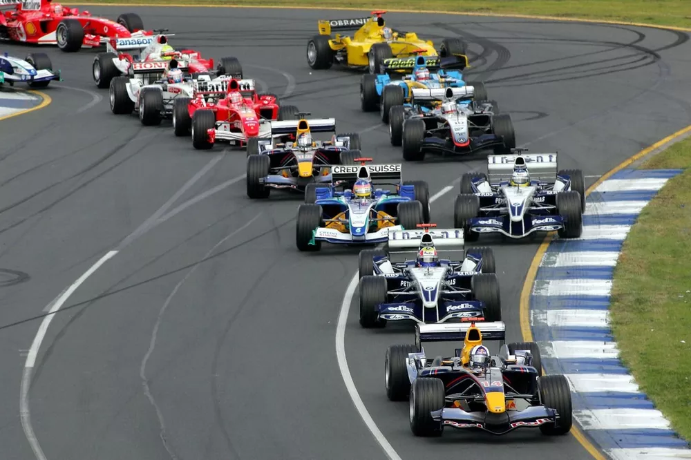 First corner action: David Coulthard leads the pack
