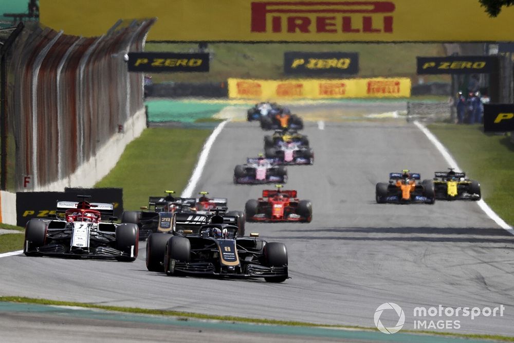 Romain Grosjean, Haas F1 Team VF-19, leads Kimi Raikkonen, Alfa Romeo Racing C38, and Kevin Magnussen, Haas F1 Team VF-19