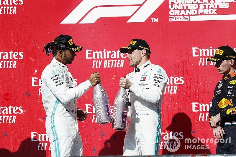 Lewis Hamilton, Mercedes AMG F1, and Valtteri Bottas, Mercedes AMG F1, celebrate on the podium with Max Verstappen, Red Bull Racing 