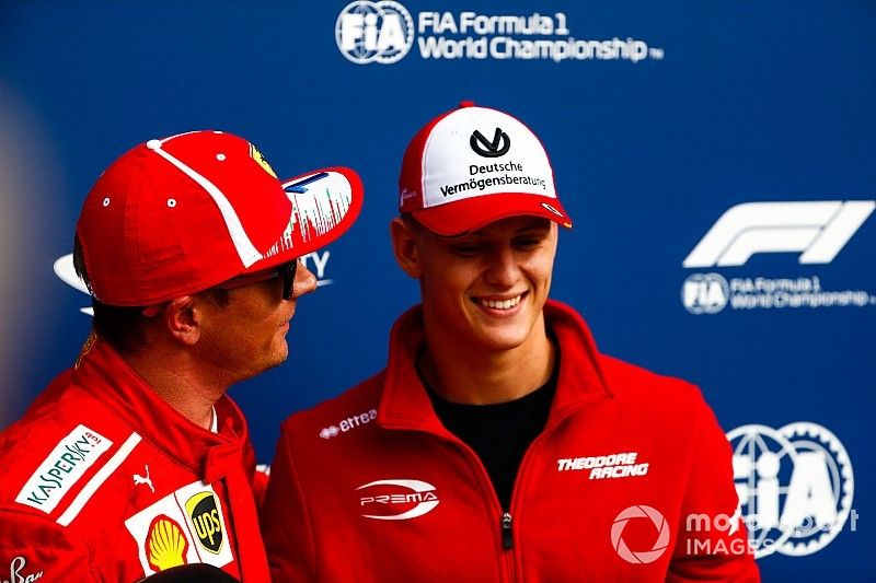 Mick Schumacher presents Kimi Raikkonen, Ferrari, with the Pirelli Pole Position award