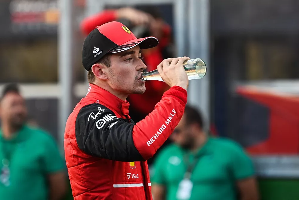 Pole man Charles Leclerc, Ferrari, takes a drink in Parc Ferme