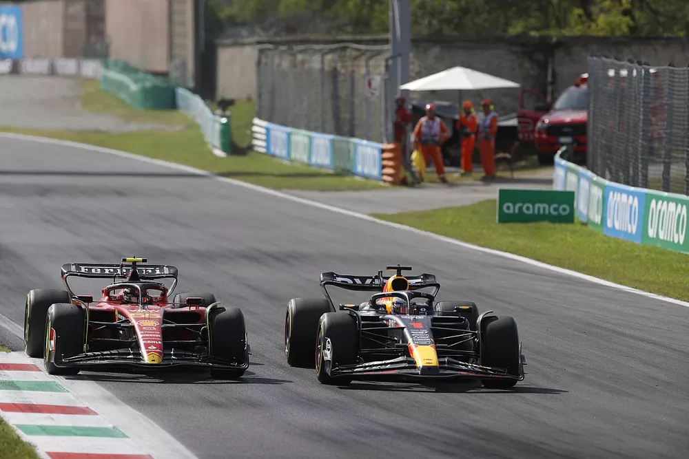 Max Verstappen, Red Bull Racing RB19, battles with Carlos Sainz, Ferrari SF-23