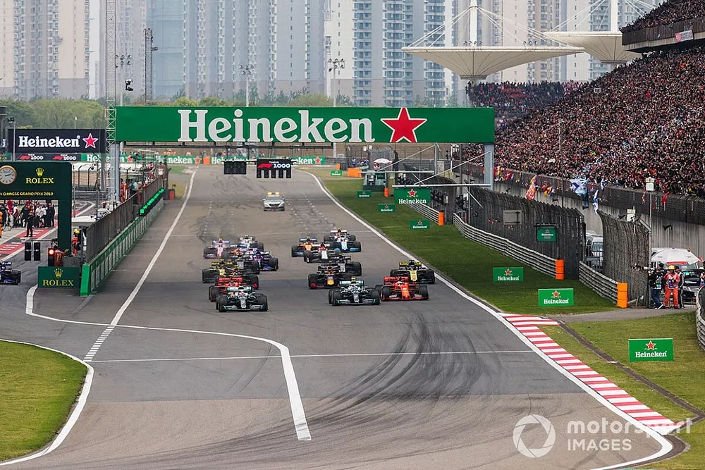 Lewis Hamilton, Mercedes AMG F1 W10, leads Valtteri Bottas, Mercedes AMG W10, Charles Leclerc, Ferrari SF90, Sebastian Vettel, Ferrari SF90, Max Verstappen, Red Bull Racing RB15, and the rest of the field towards the first corner