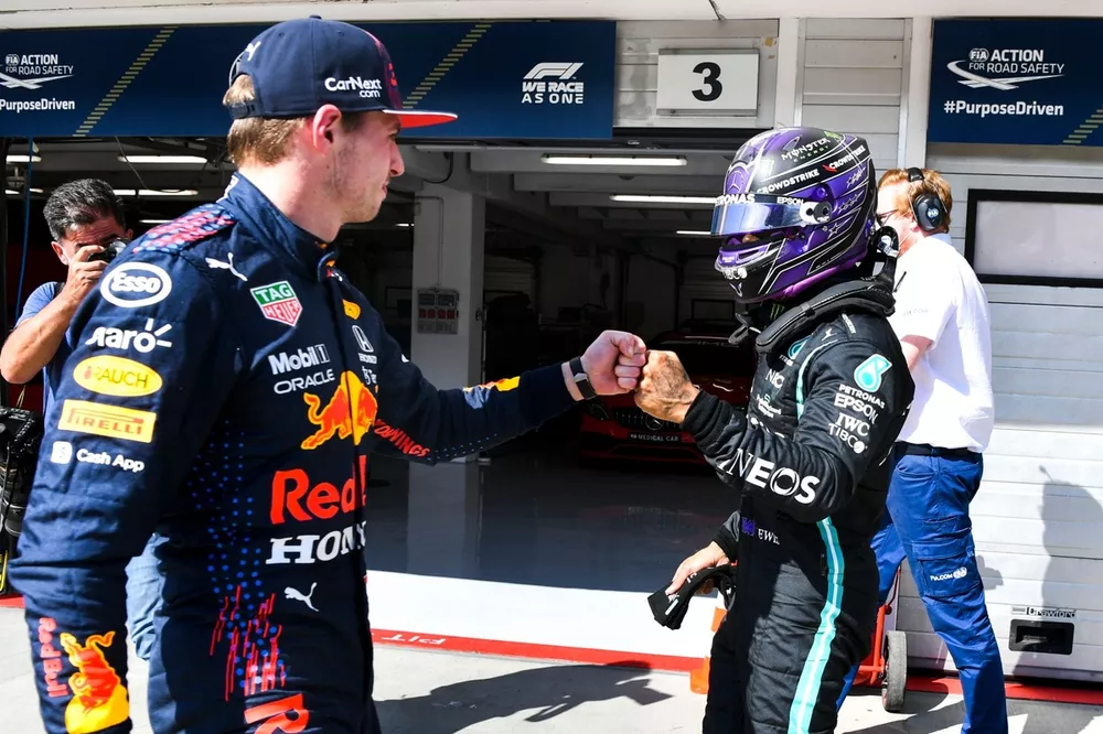 Pole man Lewis Hamilton, Mercedes, fist bumbs Max Verstappen, Red Bull Racing, in Parc Ferme after Qualifying