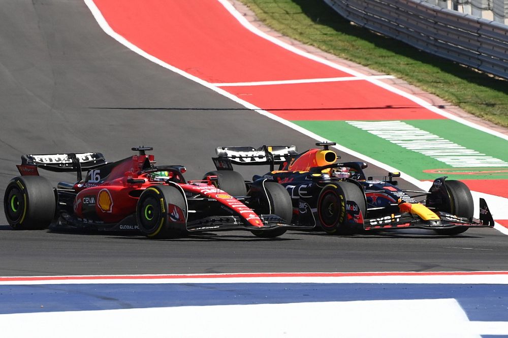 Max Verstappen, Red Bull Racing RB19, passes Charles Leclerc, Ferrari SF-23