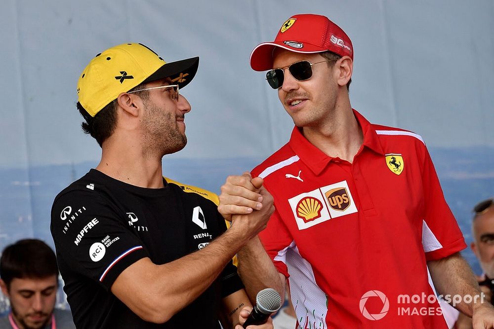 Daniel Ricciardo, Renault, and Sebastian Vettel, Ferrari, on stage