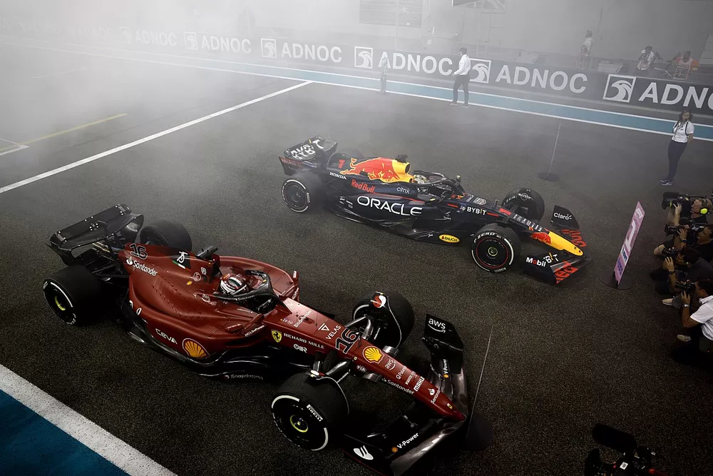 Max Verstappen, Red Bull Racing RB18, 1st position, Charles Leclerc, Ferrari F1-75, 2nd position, arrive on the grid at the end of the race
