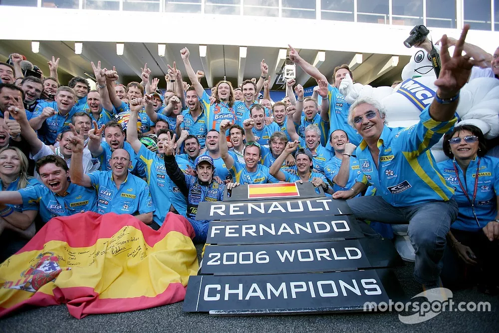 2006 F1 World Champion Fernando Alonso celebrates with Renault F1 team members