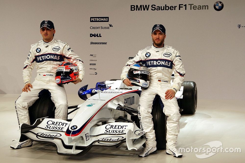 Robert Kubica and Nick Heidfeld pose with the new BMW Sauber F1.08