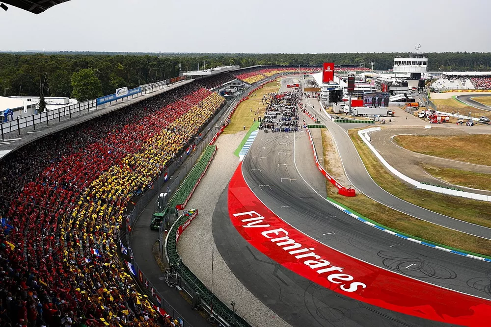 A scenic view of the grid at Hockenheim as fans wear the German national colours