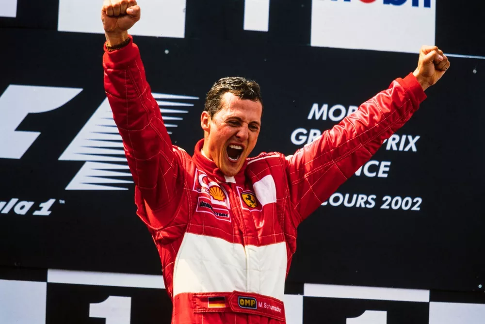 Michael Schumacher, 1st position, celebrates securing his fifth world drivers' championship on the podium.