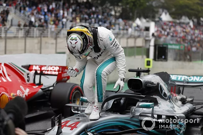 Lewis Hamilton, Mercedes AMG F1, celebrates taking pole position in parc ferme.