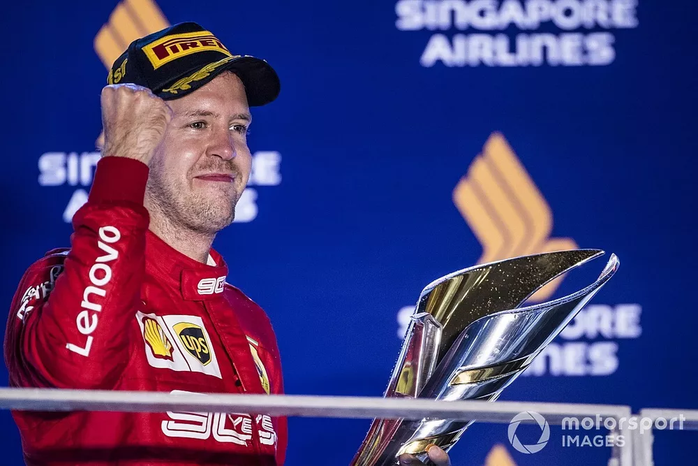 Sebastian Vettel, Ferrari, 1st position, with his trophy
