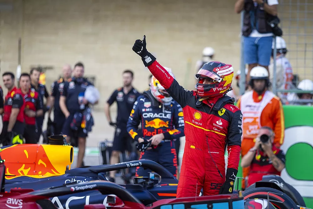 Pole man Carlos Sainz, Ferrari, gives a thumbs up from Parc Ferme