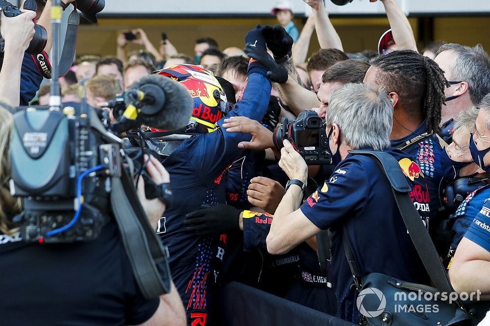 Sergio Perez, Red Bull Racing, 1st position, celebrates with his team in Parc Ferme