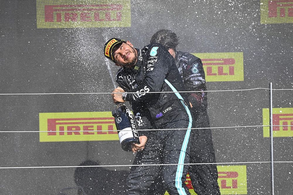 Lewis Hamilton, Mercedes, 1st position, celebrates with his team mate on the podium