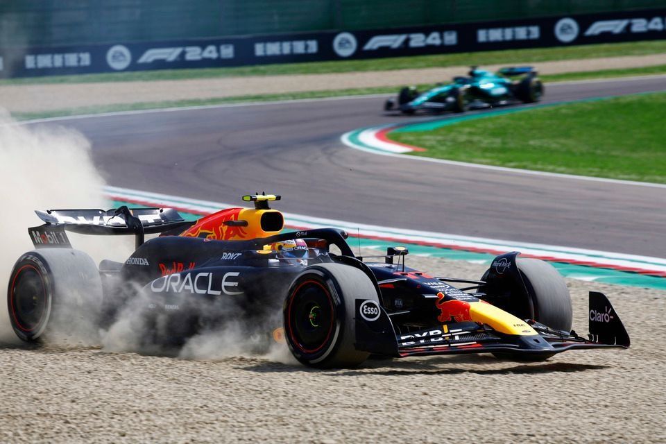 Sergio Perez, Red Bull Racing RB20, drives off the track into the gravel