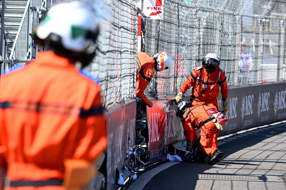 Marshals repair some trackside advertising
