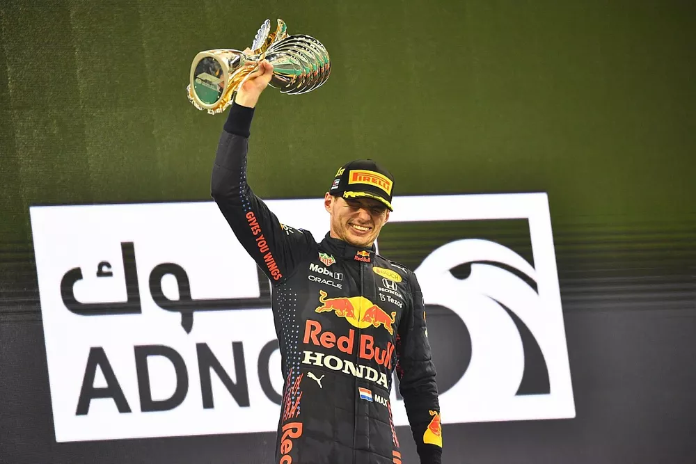 Max Verstappen, Red Bull Racing, 1st position, lifts his trophy on the podium