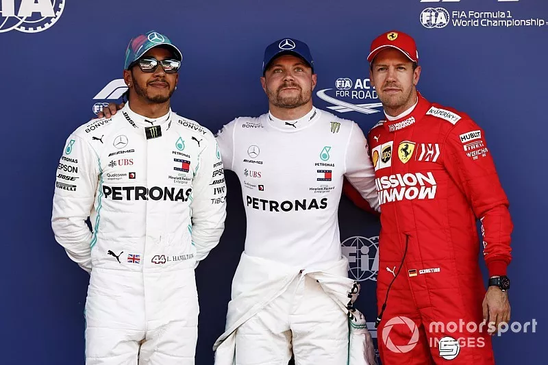 Lewis Hamilton, Mercedes AMG F1, Pole Sitter Valtteri Bottas, Mercedes AMG F1 and Sebastian Vettel, Ferrari in Parc Ferme