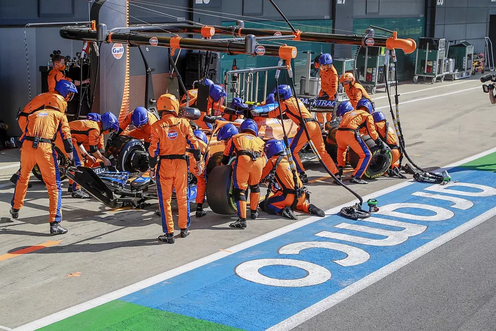 Lando Norris, McLaren MCL35M, makes a pit stop
