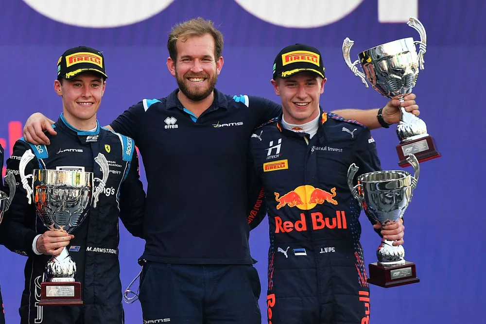 Liam Lawson, Hitech Grand Prix, 2nd position, Marcus Armstrong, Dams, 1st position, Juri Vips, Hitech Grand Prix, 3rd position, on the podium