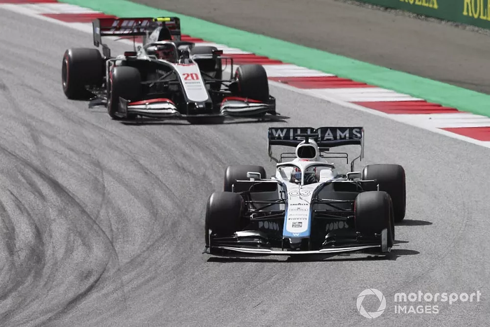 George Russell, Williams FW43, leads Kevin Magnussen, Haas VF-20, and Daniil Kvyat, AlphaTauri AT01