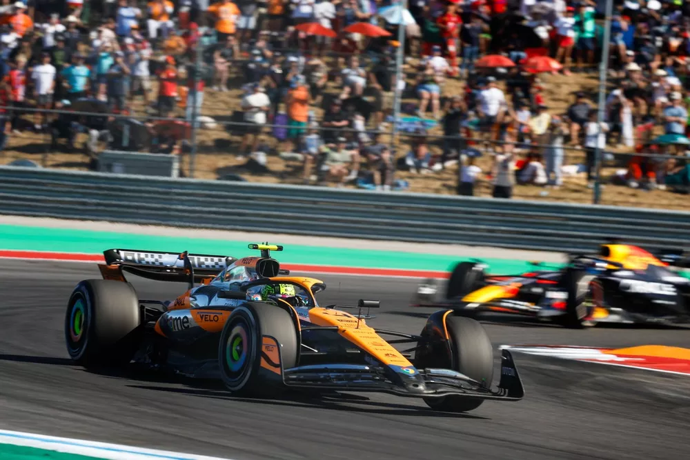 Lando Norris, McLaren MCL38, leads Max Verstappen, Red Bull Racing RB20