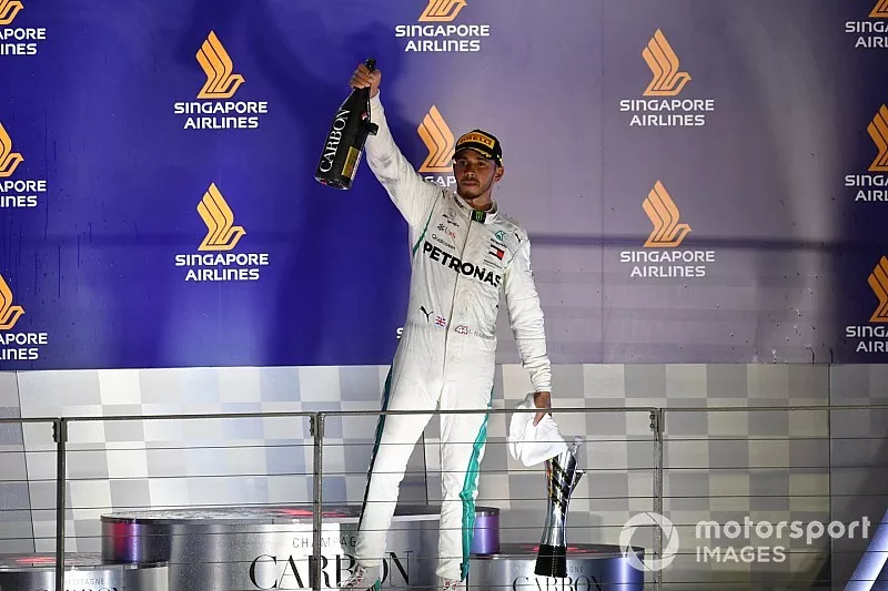 Lewis Hamilton, Mercedes AMG F1 celebrates with the champagne on the podium 