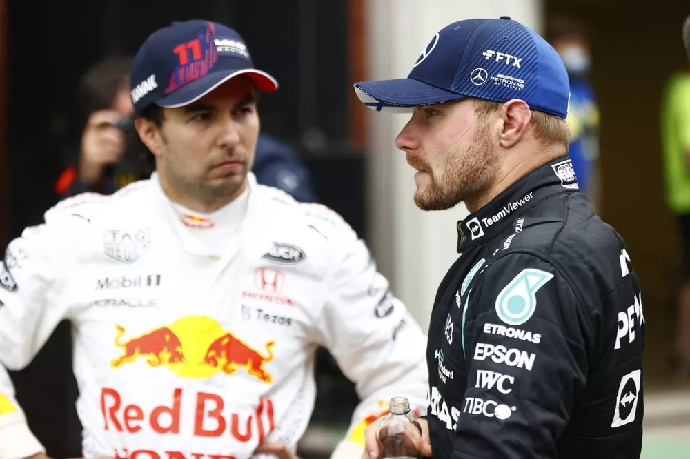 Sergio Perez, Red Bull Racing, 3rd position, and Valtteri Bottas, Mercedes, 1st position