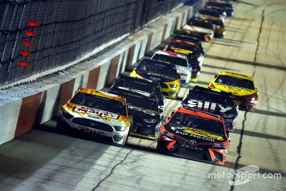 Martin Truex Jr., Joe Gibbs Racing, Toyota Camry leads Ryan Newman, Roush Fenway Racing, Ford Mustang