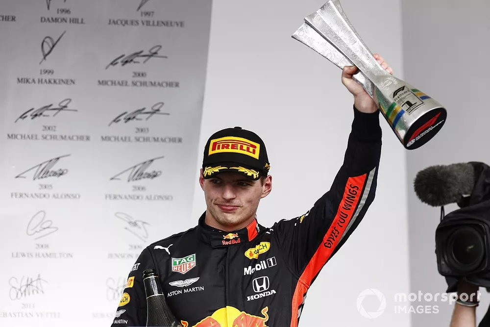 Race winner Max Verstappen, Red Bull Racing celebrates on the podium with the trophy