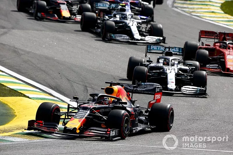 Max Verstappen, Red Bull Racing RB15, leads Lewis Hamilton, Mercedes AMG F1 W10, Charles Leclerc, Ferrari SF90, and the rest of the field through the first corners