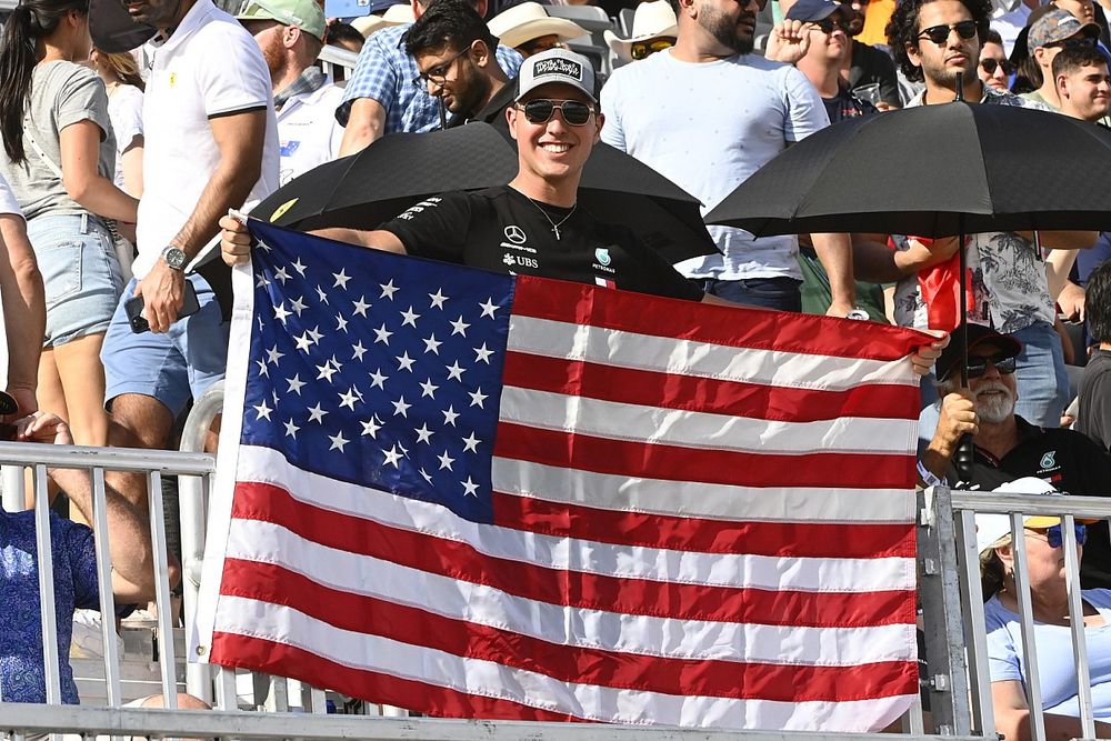A fan with a US flag in a grandstand
