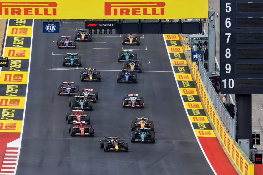 Max Verstappen, Red Bull Racing RB20, George Russell, Mercedes F1 W15, Charles Leclerc, Ferrari SF-24, Lando Norris, McLaren MCL38, Carlos Sainz, Ferrari SF-24, Kevin Magnussen, Haas VF-24, the rest of the field at the start of the Sprint race
