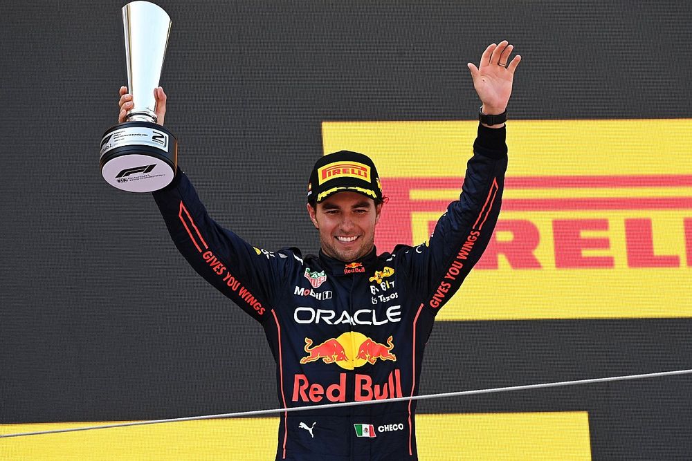 Sergio Perez, Red Bull Racing, 2nd position, on the podium with his trophy